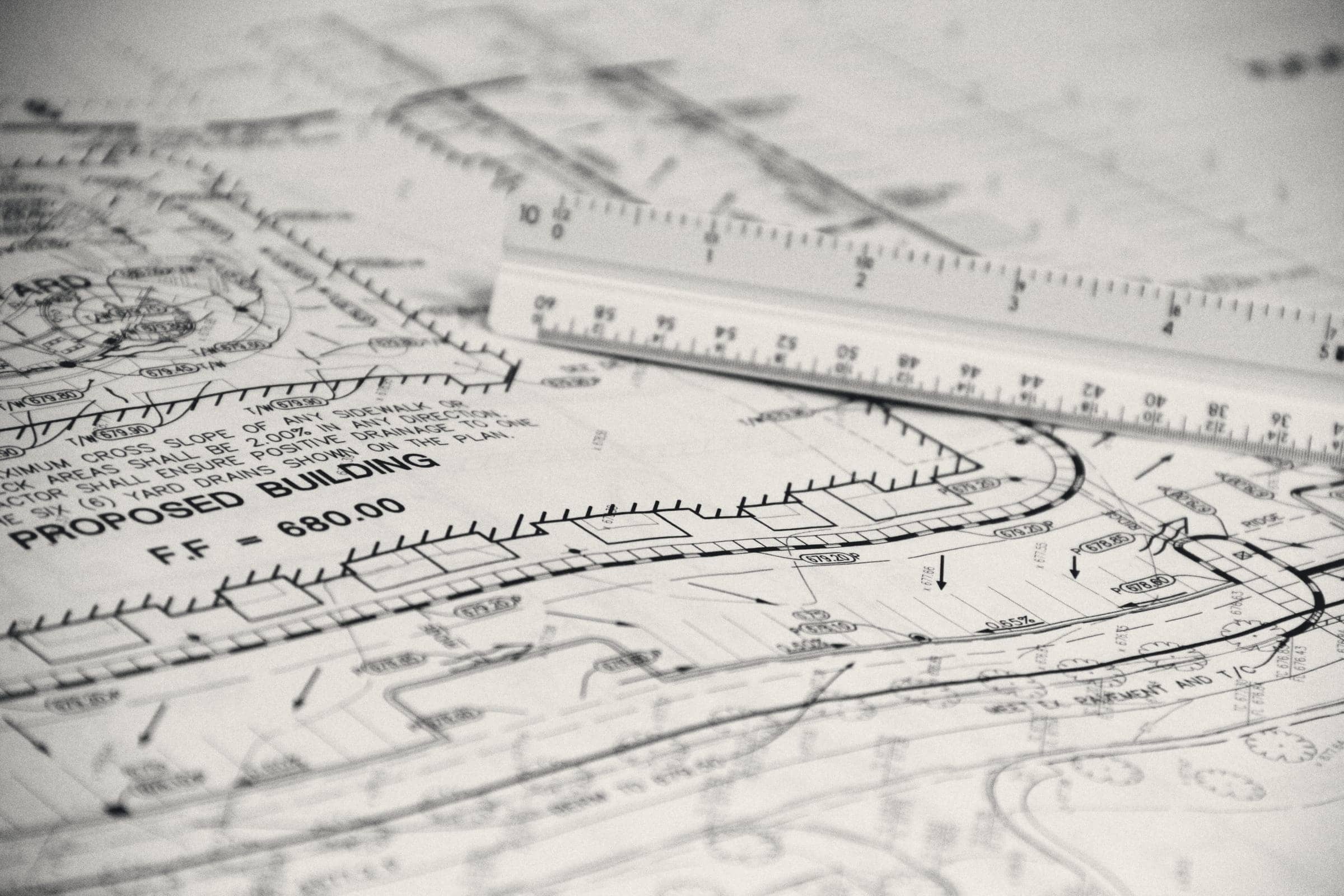 A drawing sheet with an architect’s scale ruler resting on it.